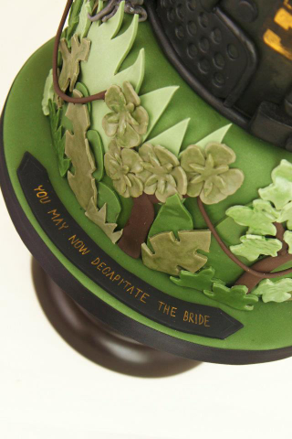 Illustration for article titled This Alien versus Predator wedding cake is disturbingly adorable